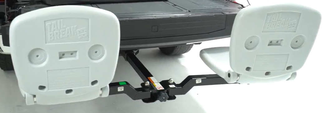Black truck bed with a white hitch receiver on a white background