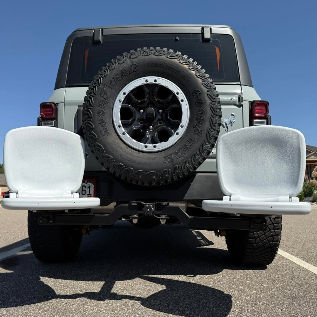 Back view of a grey jeep with the ultimate hitch mounted seats tailbreaker