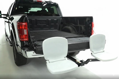 Black pickup truck with white boat seats attached to the bed on a white background