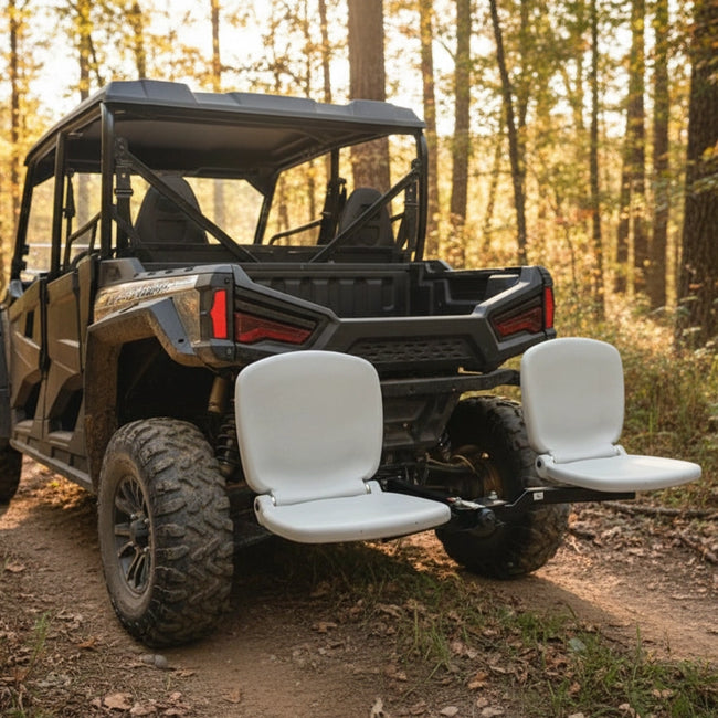 Utility vehicle with tailbreaker seating system installed on it in a forest setting.Proving its ourdoor adventure uses are versatile